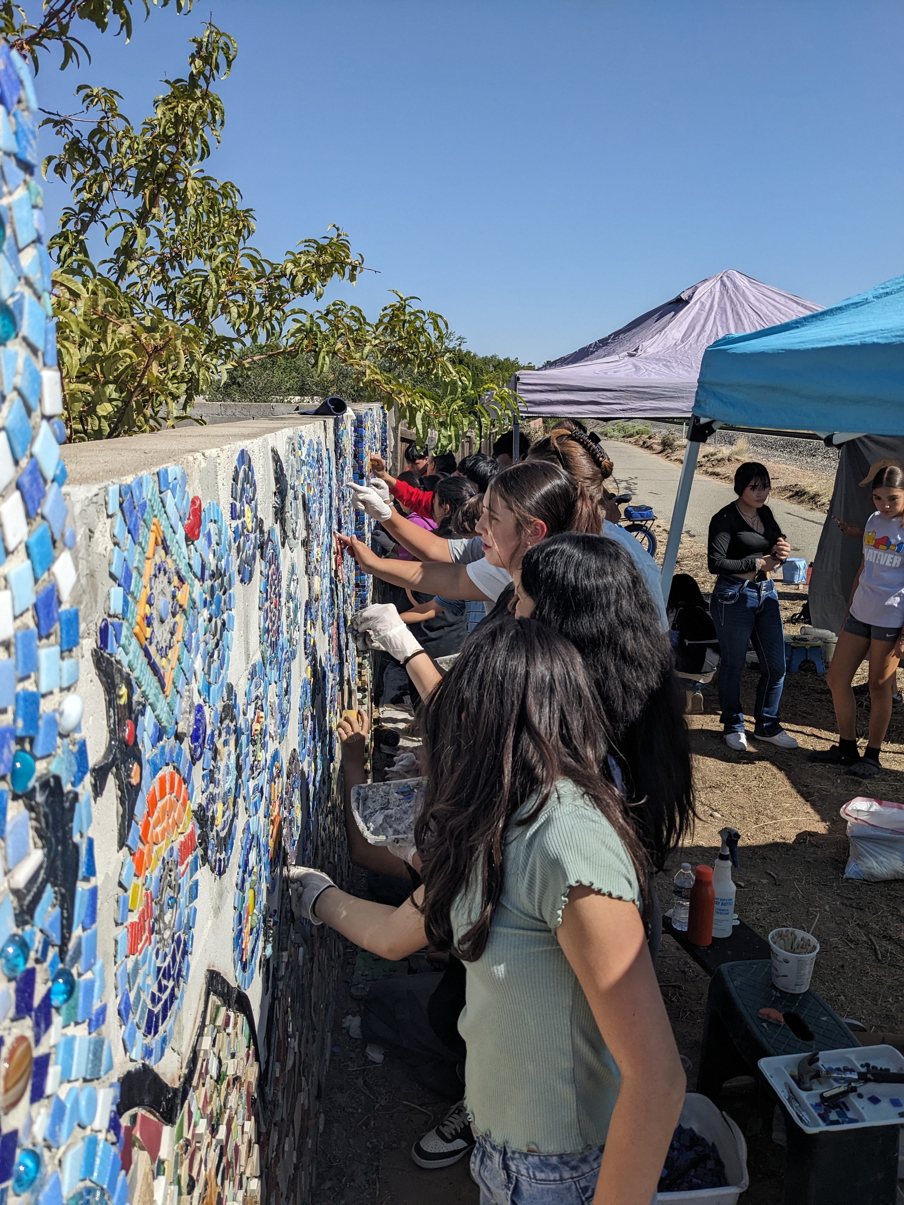 Gonzalez Community School students working on the wall